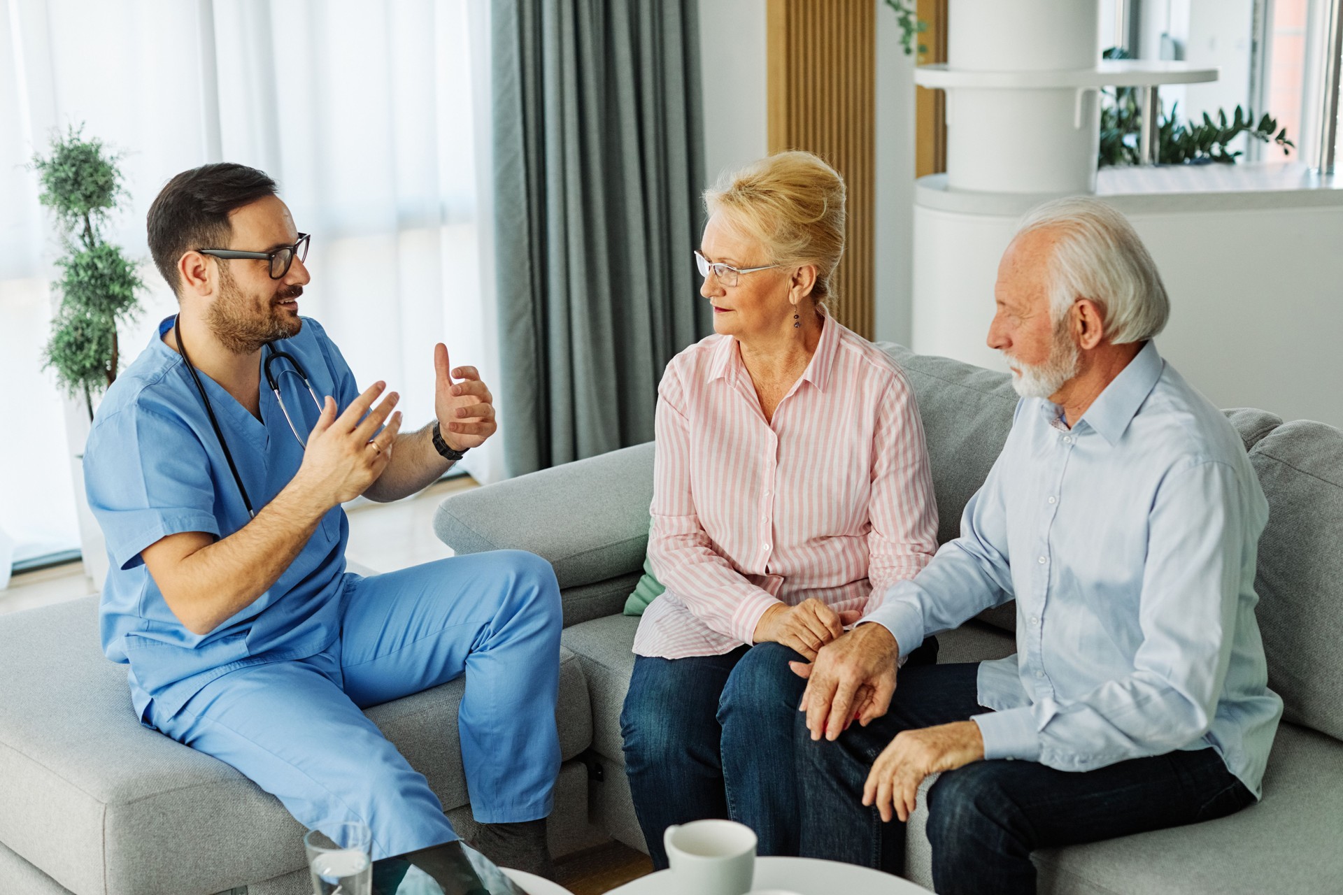 nurse doctor senior couple care caregiver help assistence retirement home nursing elderly man woman insurance clinic