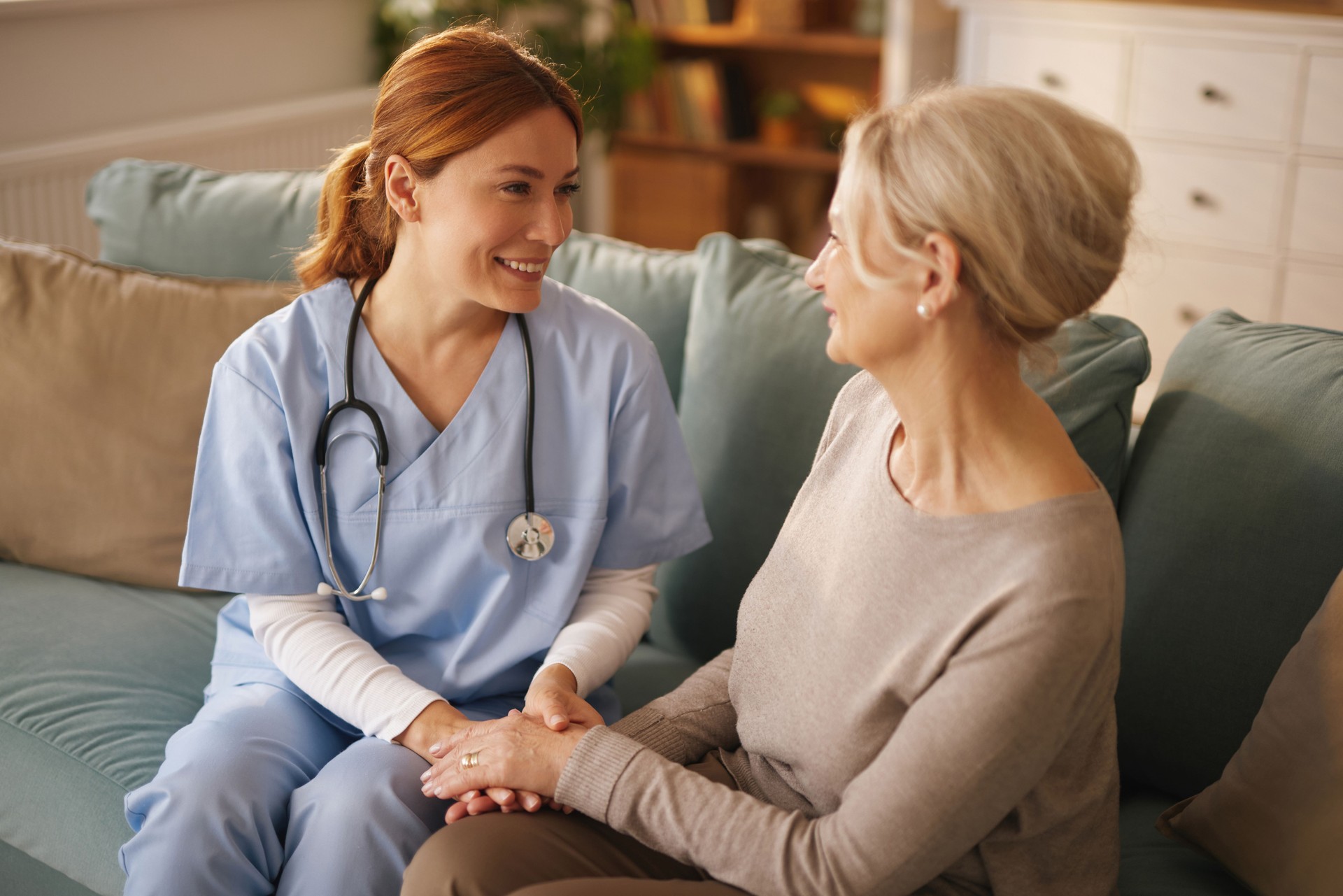 Caring nurse providing supportive home care